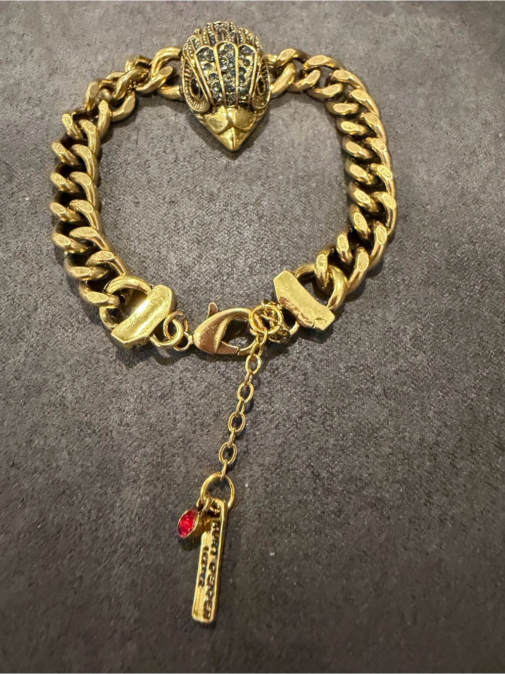 Kurt Geiger Gold-Tone Eagle Head Link Bracelet with Red Charm
